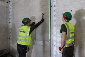 Installing Newton cavity drain membrane to vault walls