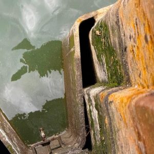 Over 100 irregular voids between the piles needed sealing